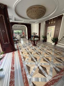 a lobby with a tile floor and a ceiling at La Boutique Residence in Hurghada