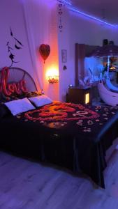 a bedroom with a bed with a balloon on it at Le relax & vous in La Louvière +14 photos