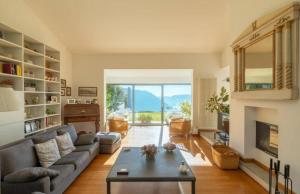 a living room with a couch and a table at Villa Citriodora in Cernobbio