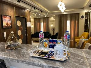 a tray of drinks on a table in a hotel room at The Royal Apartment at New Cairo in Cairo