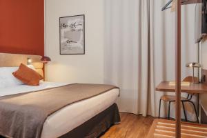 a hotel room with a bed and a desk at H Regas Adults Only in Barcelona +38 photos