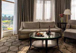 a living room with a couch and a table at The Magnolia Hotel & Spa in Victoria