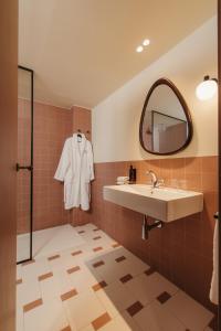 a bathroom with a sink and a mirror at H Regas Adults Only in Barcelona