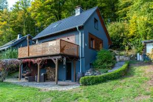 a blue house with a gambrel roof at Modern Birch Chalet At Ruppberg in Zella-Mehlis