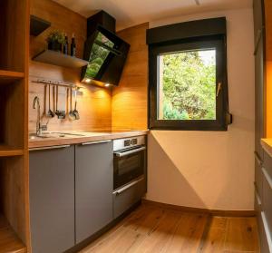 a kitchen with a sink and a window at Modern Birch Chalet At Ruppberg in Zella-Mehlis