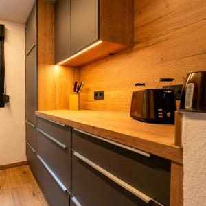 a kitchen with a counter with a toaster on it at Modern Birch Chalet At Ruppberg in Zella-Mehlis
