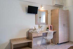 TV a/nebo společenská místnost v ubytování Studio Nikos