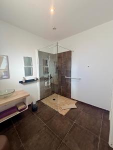 a bathroom with a shower with a glass door at CARPE DIEM Résidence Hôtelière in Lorgues +88 photos
