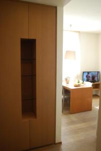 a sliding door in a room with a dining room at Ceccarini Suite in Riccione