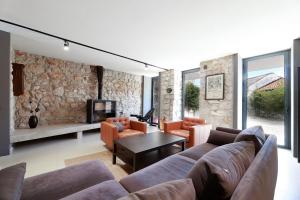 a living room with a couch and a table at Villa Arija in Grižane