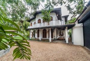 an exterior view of a house with a driveway at Tara Luxury House in Habaraduwa Central