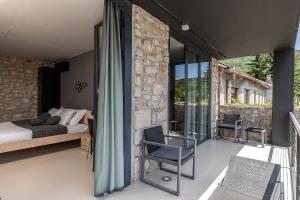 a bedroom with a bed and a balcony at Villa Arija in Grižane +89 photos