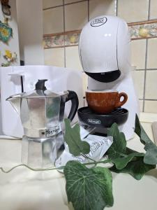 a coffee maker sitting on top of a counter at Sciara casa vacanze in Viagrande