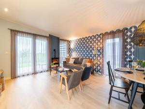 a living room with a couch and a table at Bij de Bakker in Oud-Ade