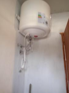 a bathroom with a white sink in a room at Los Cali 27 planta alta 1 in Balneario Buenos Aires