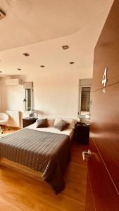 a bedroom with a large bed in a room at Red House Rooms in Llucmajor +71 photos