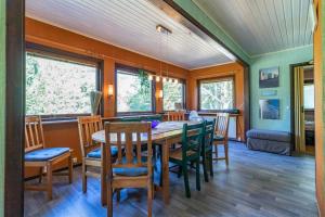 a dining room with a table and chairs at KRO906-Lidhult-Torseryd-4 in Lidhult