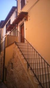 a staircase leading up to a building with a stair case at Arianna House in Raiano