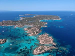 an aerial view of an island in the ocean at House Pale Rooms in Palau