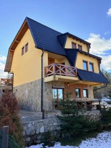 a large house with a blue roof at Villa Rustica in Šišava