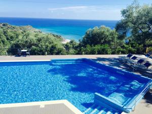 a swimming pool with a view of the ocean at Villaggio Turistico La Fenosa in Marina di Camerota +19 photos
