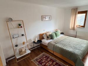 a bedroom with a large bed and a window at Villa Rustica in Šišava