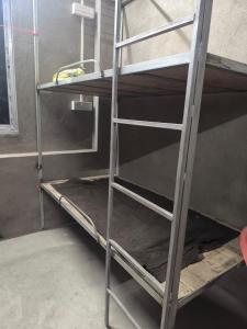 a ladder of a bunk bed in a room at dormatery rooms in Jāmb