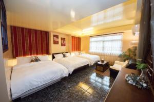 A bed or beds in a room at Blissful Star