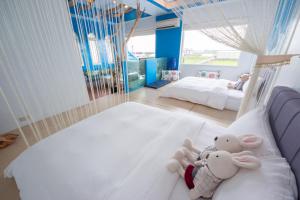 A bed or beds in a room at Blissful Star