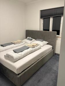 two beds sitting next to each other in a room at Spacious & Cozy home with open kitchen lounge in Søborg