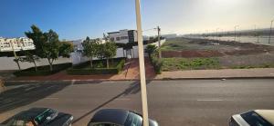 a street with cars parked on the side of a road at Appartement stylia 2 in Agadir