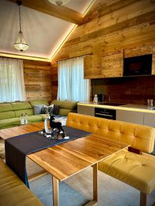a living room with a table with a cat statue on it at SeeChalet Hallstatt in Bad Goisern