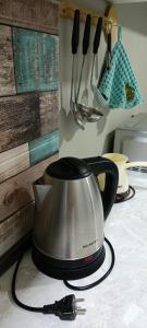 a tea kettle is sitting on a counter top at Welcome Guests in Tbilisi City