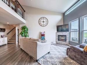 a living room with a couch and a fireplace at Black Hills Barndo-Hot Tub & Massage Chair in Hermosa