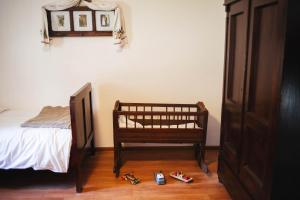 a bedroom with a bed and some shoes on the floor at Kuća za odmor San in Lonja +58 photos
