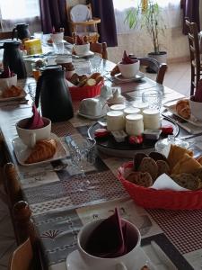 a long table with a buffet of food on it at La barque aux Romarins in Orange