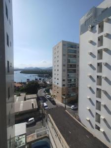an aerial view of a city with buildings at Diamante guarapari in Guarapari