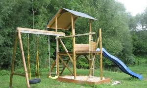 a play structure with a slide and a playground at Ferienhaus am Mittelberg in Nordhausen