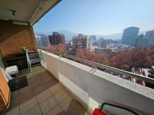 a balcony with a view of a city at Living Suite in El Cerrillo
