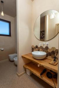 a bathroom with a sink and a mirror at Suite & Spa Carignano Grande in Nardò +11 photos