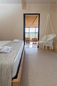 a bedroom with two beds and a swing at Suite & Spa Carignano Grande in Nardò