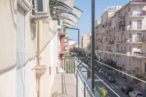 a view of a city street from a balcony at Suite Benvenuti al Sud in Crotone