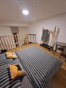 a room with a bed and a table and chairs at ApartmánPohoda in Opava