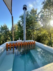 a swimming pool with a light in the middle at Ecoraleo in Concepción
