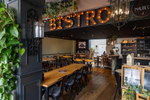 a dining room with wooden tables and chairs at Le Bistro in Valkenburg