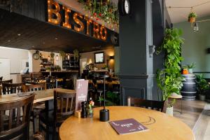 a restaurant with tables and chairs and a sign that reads bistro at Le Bistro in Valkenburg +29 photos