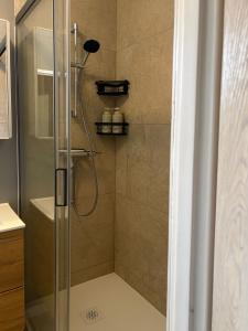 a shower with a glass door in a bathroom at Rodzinna Przystań in Białystok +24 photos
