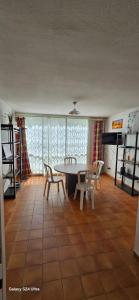 a dining room with a table and chairs at Montago in Le Gosier