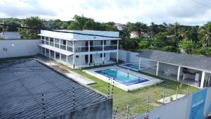 an aerial view of a house with a swimming pool at Villa Beija-flor in Camacari