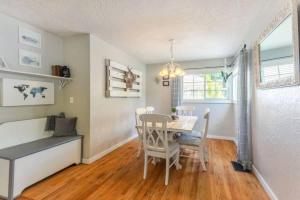 a dining room with a table and chairs at Copper Voyage, Fenced Backyard in Coeur d'Alene